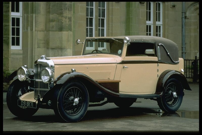 Vintage car in front of building