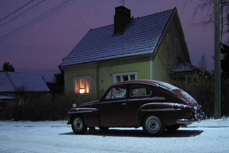 Vintage car in snowy evening
