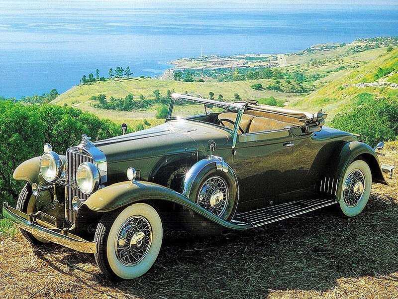 Vintage car on a coastal hill