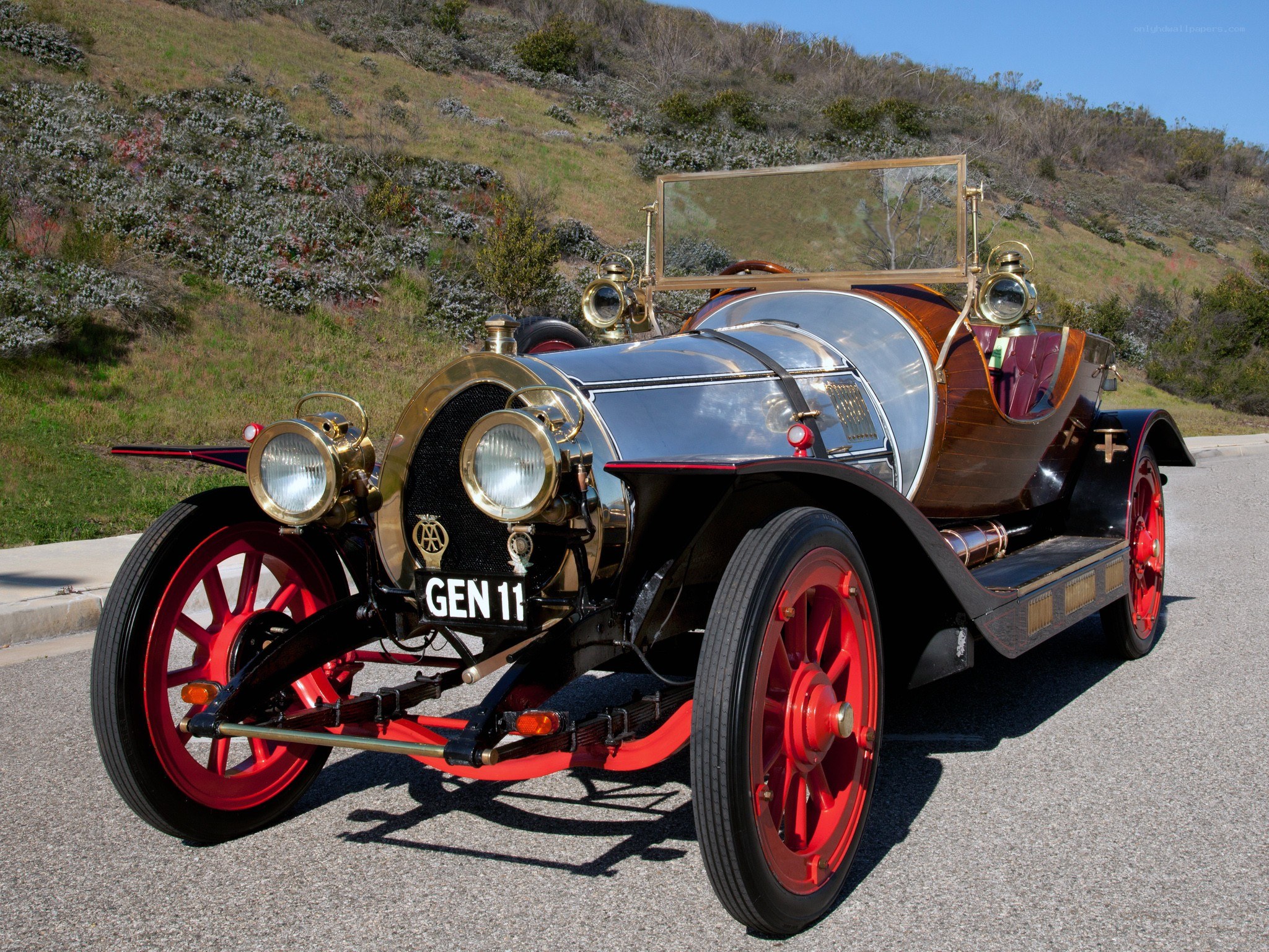 vintage car on a hillside road