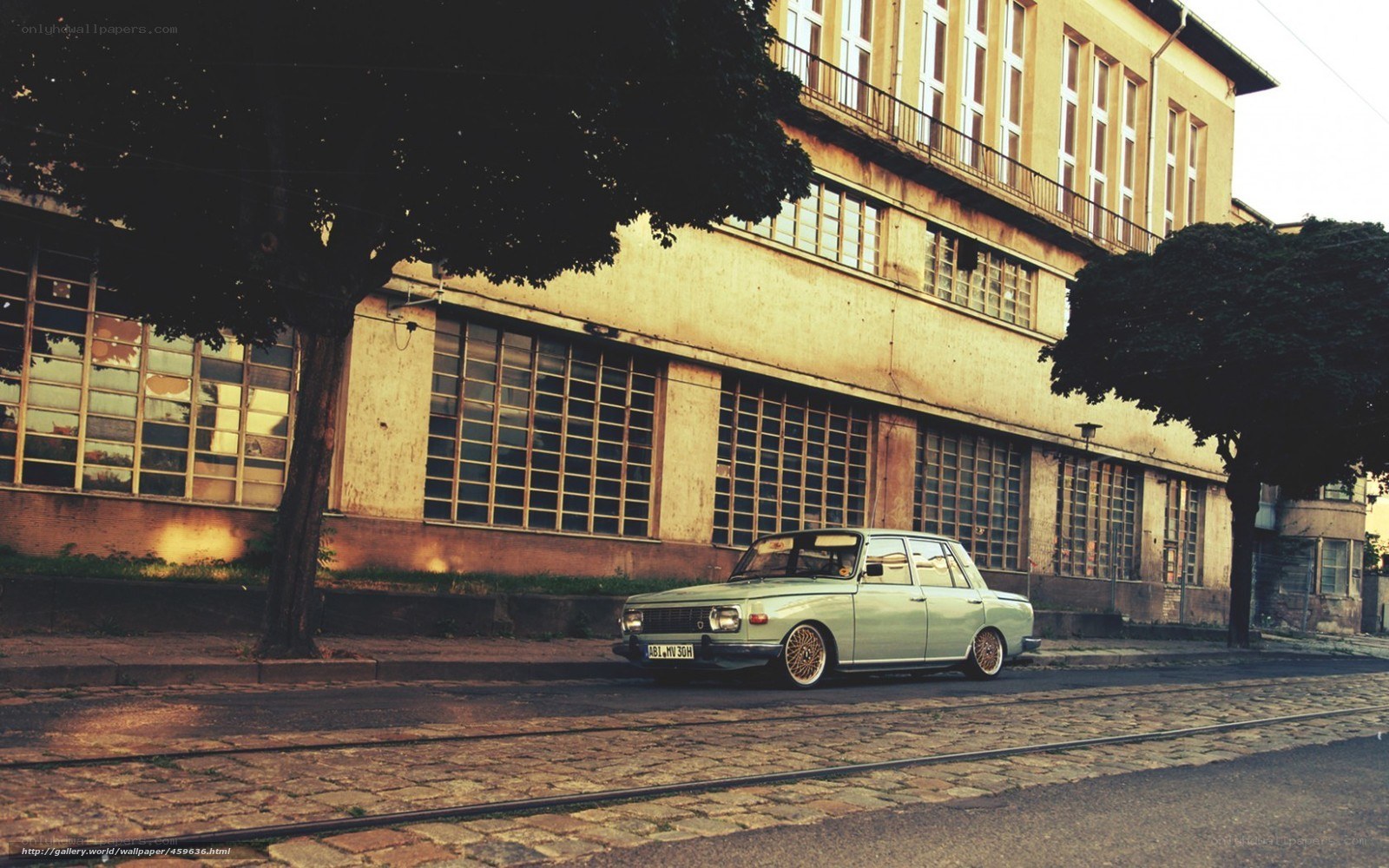 vintage car on cobblestone street