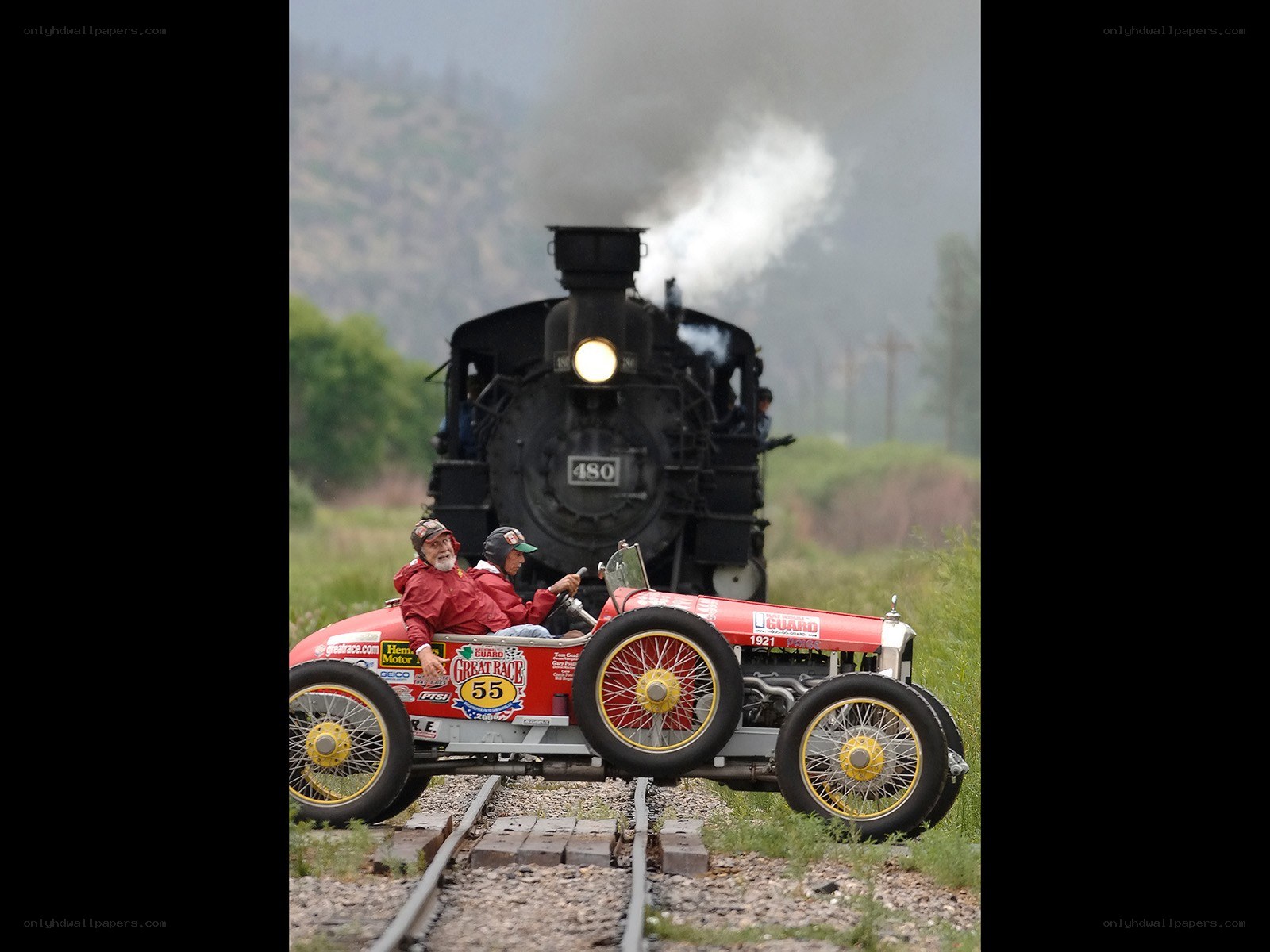 Vintage car on train tracks