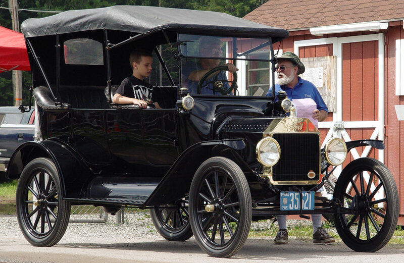 Vintage car with boy and man