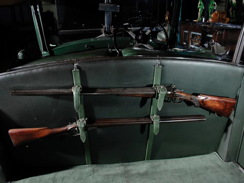 Vintage car with rifles
