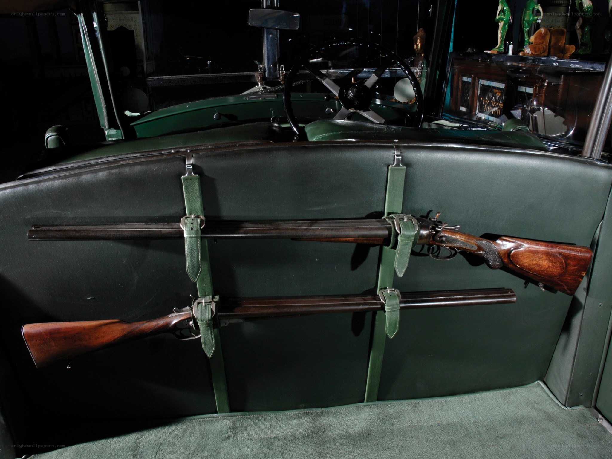 Vintage car with rifles