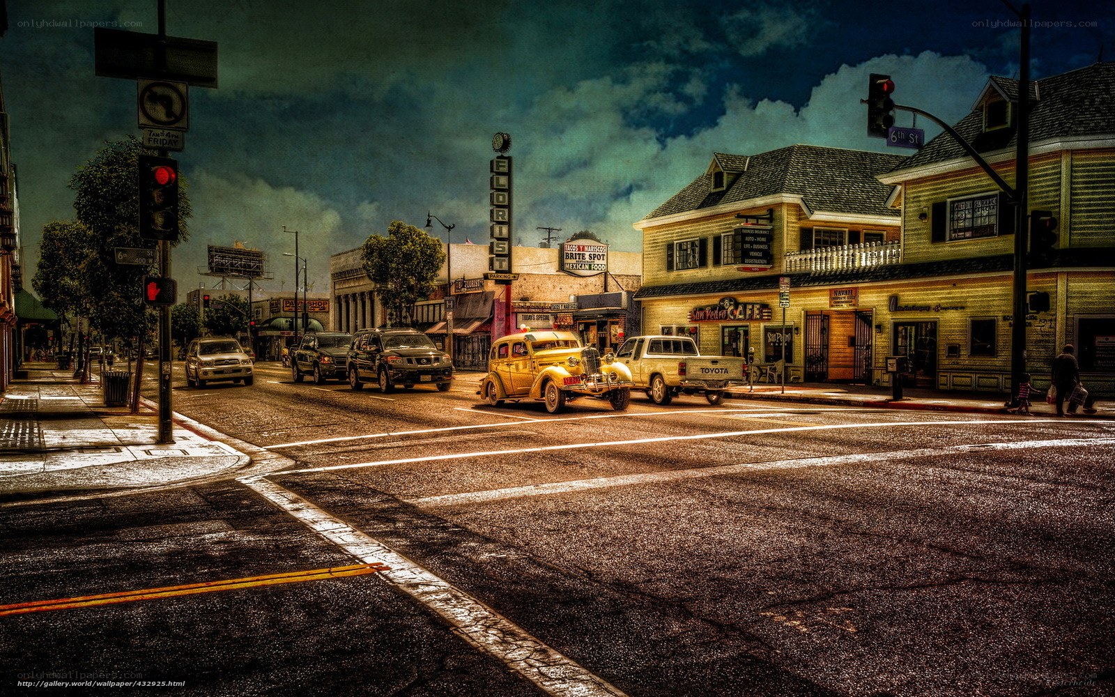 Vintage cars at a city intersection