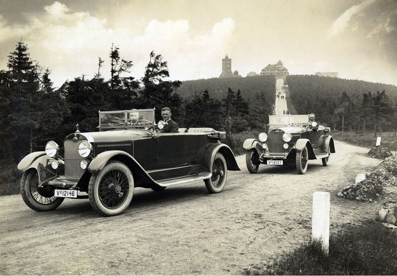 Vintage cars on a mountain road