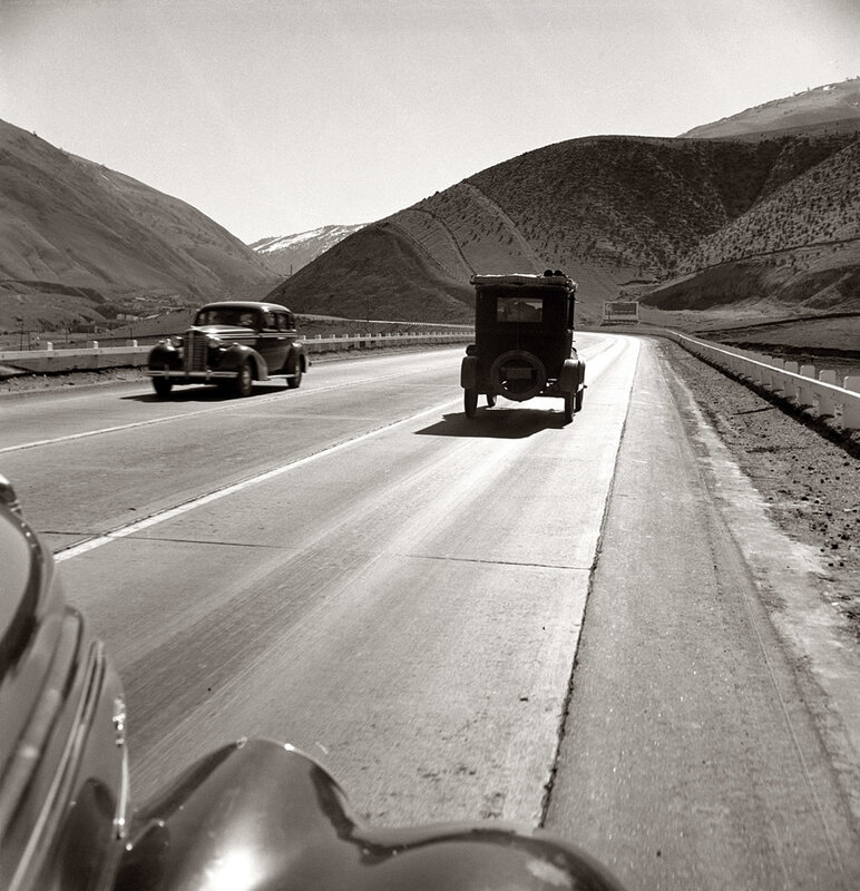 Vintage cars on a mountain road