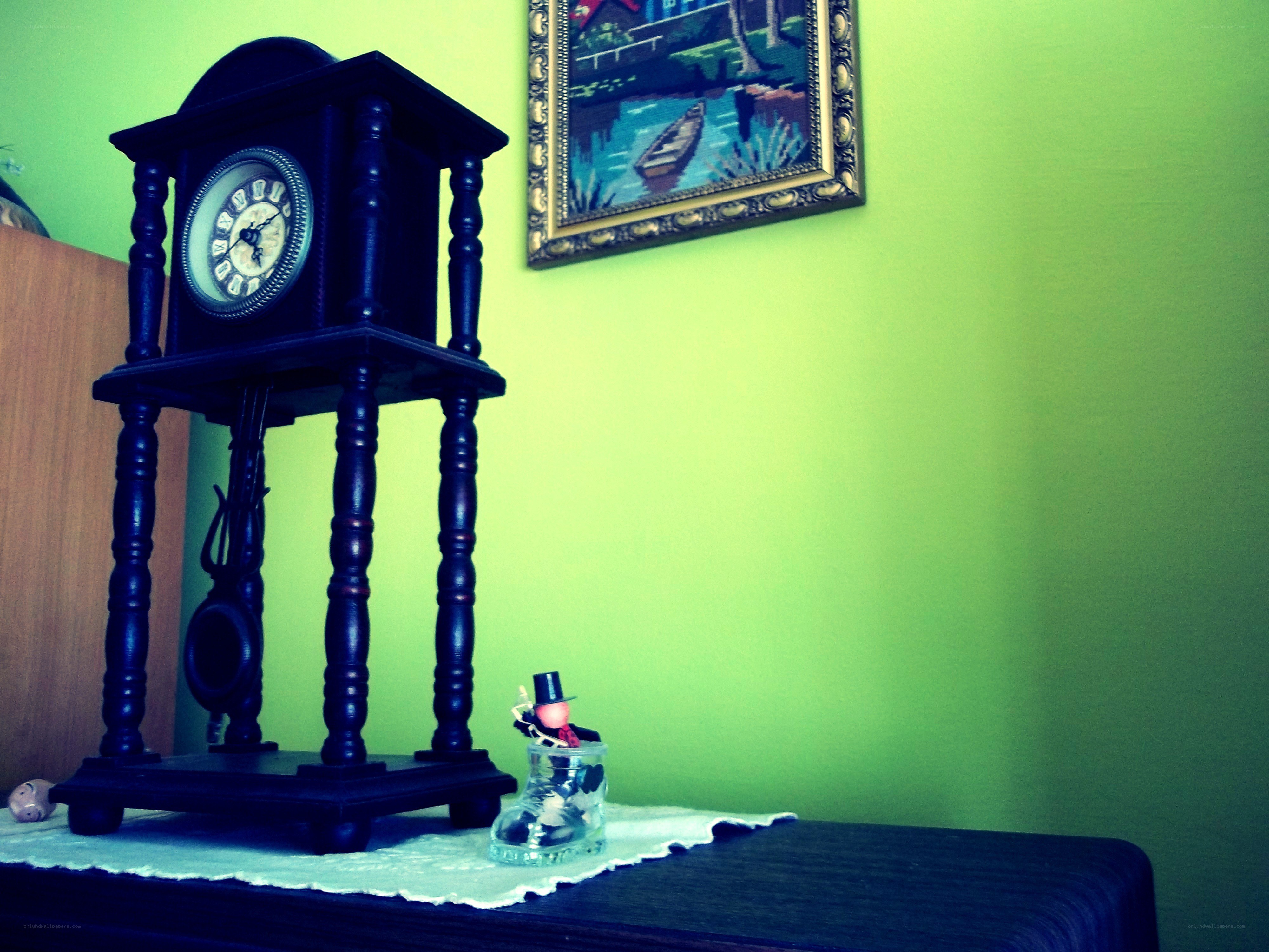 Vintage clock on a green wall