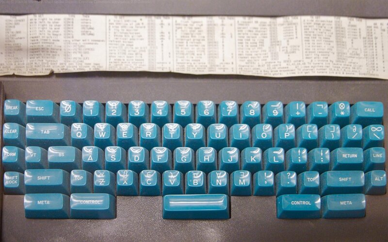 vintage computer keyboard with teal keys