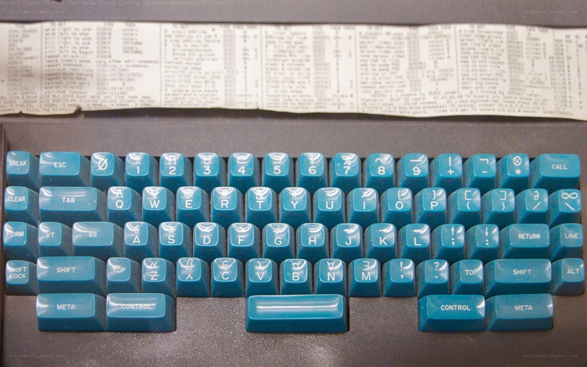 vintage computer keyboard with teal keys