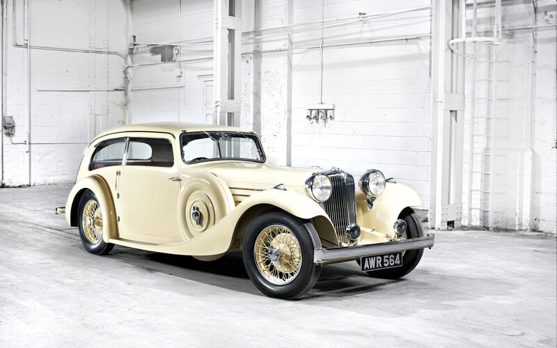 Vintage cream car in warehouse