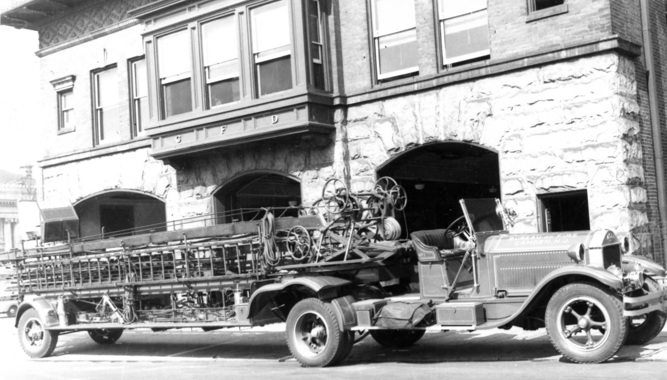 Vintage fire truck outside station
