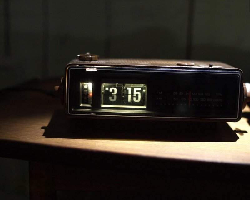 vintage flip clock on wooden table