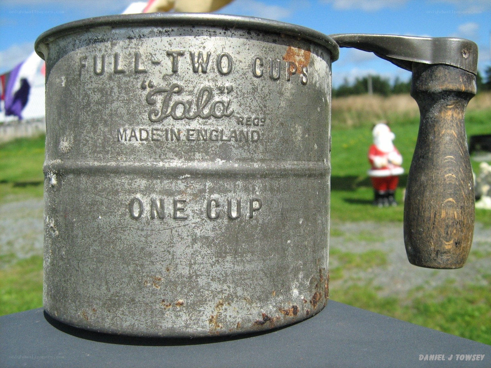 vintage flour sifter outdoors