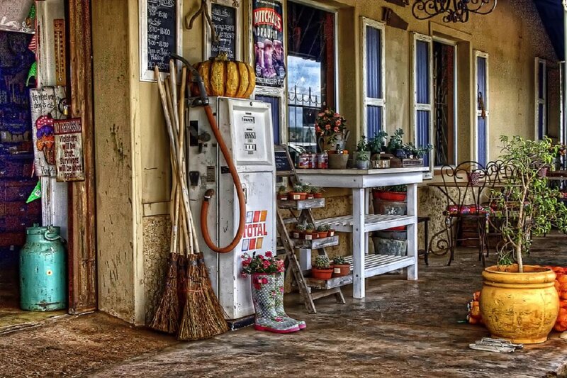 Vintage Gas Pump and Brooms