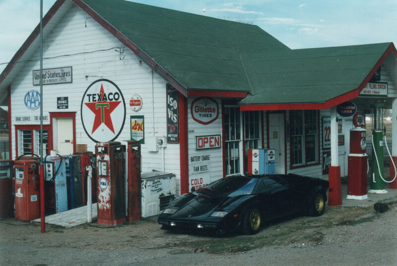vintage gas station with classic car