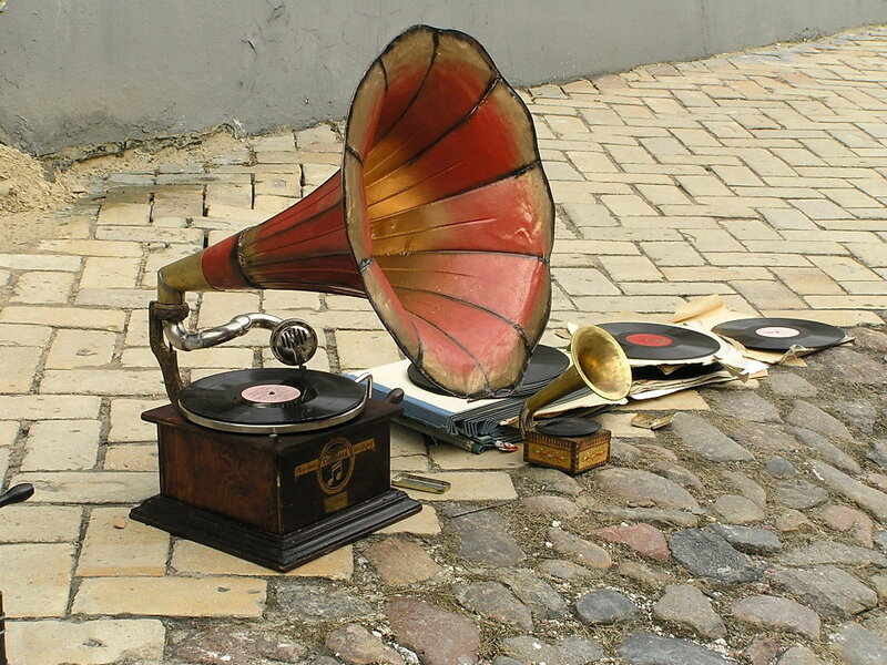 Vintage gramophone on cobblestones