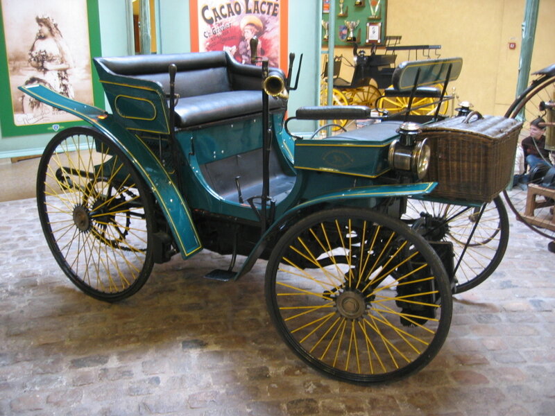 vintage green automobile on display