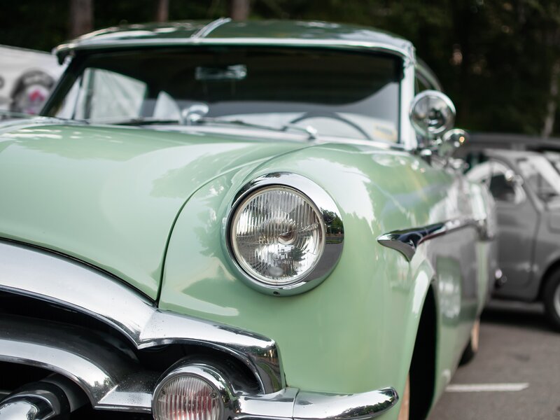 vintage green car at a show