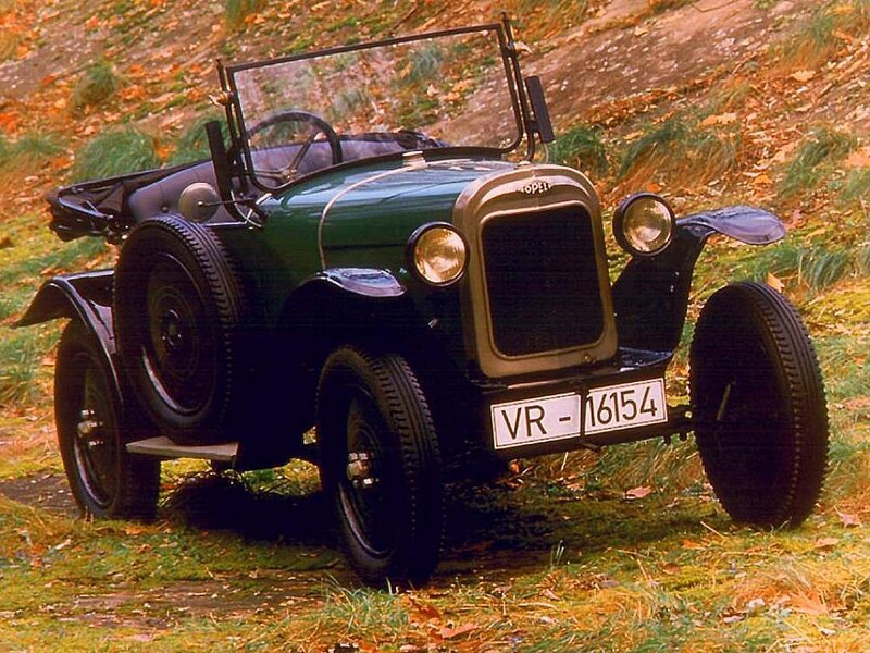 vintage green car on grass