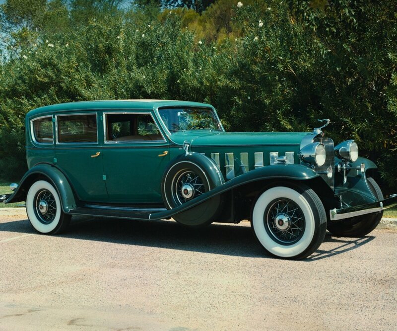 Vintage green car on pavement