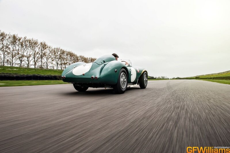 vintage green race car on track