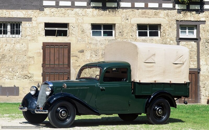 vintage green truck with canvas cover