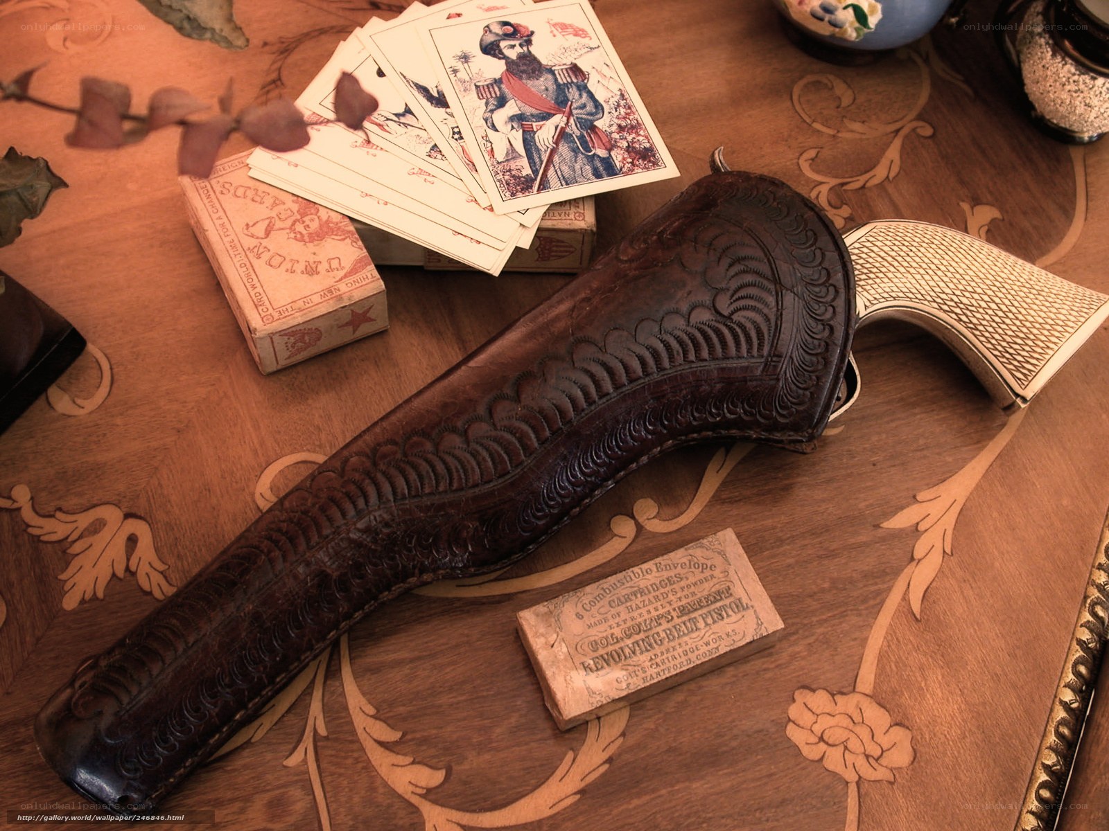 Vintage gun and cards on table