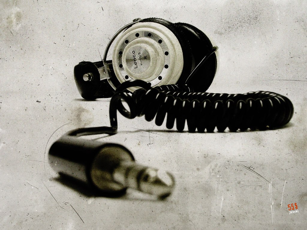 Vintage headphones on textured surface