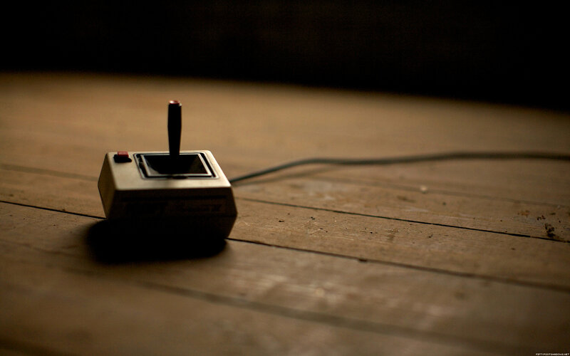 Vintage joystick on wooden floor