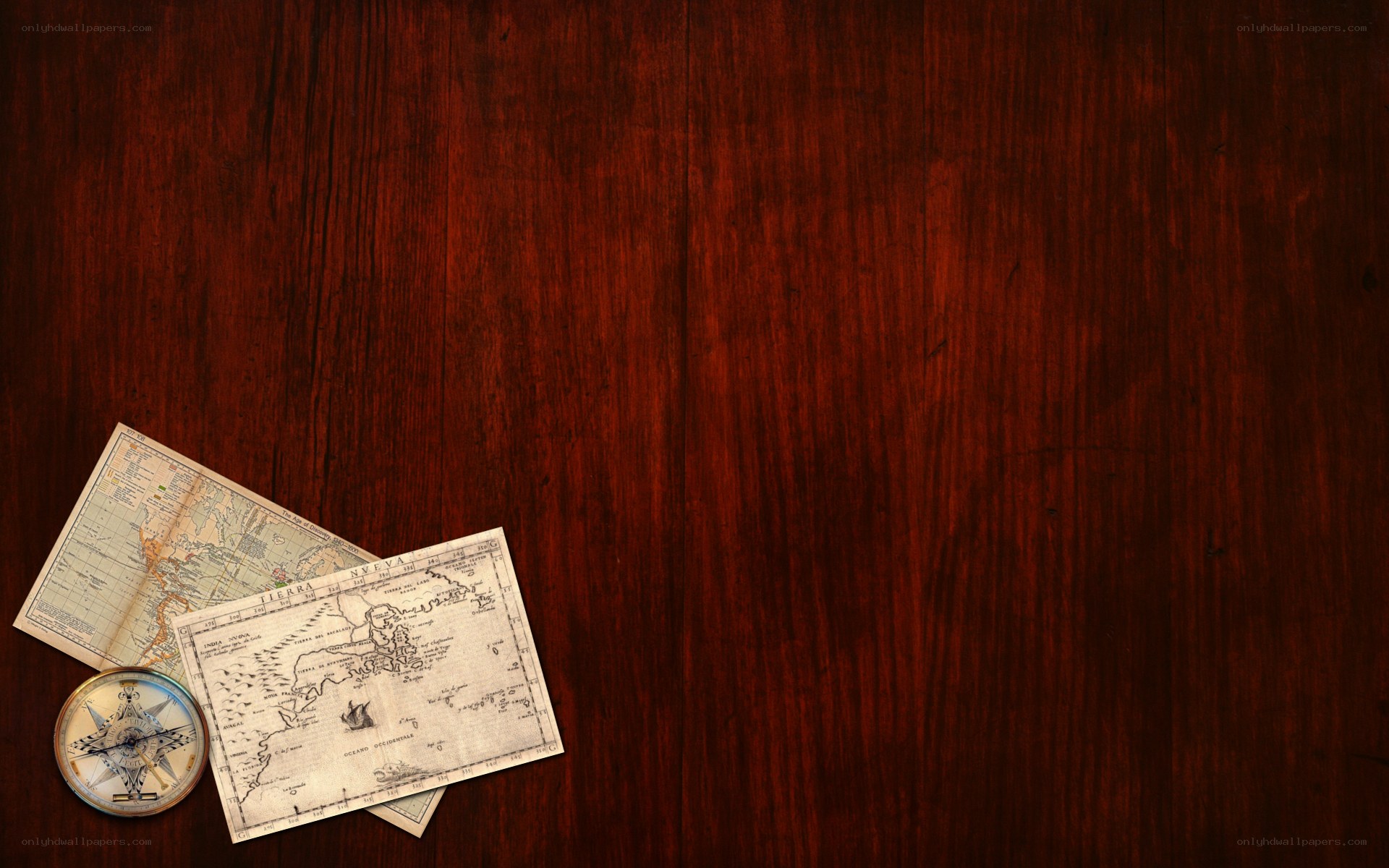 Vintage map and compass on wood