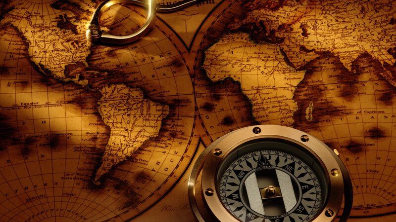 Vintage map with compass and magnifying glass
