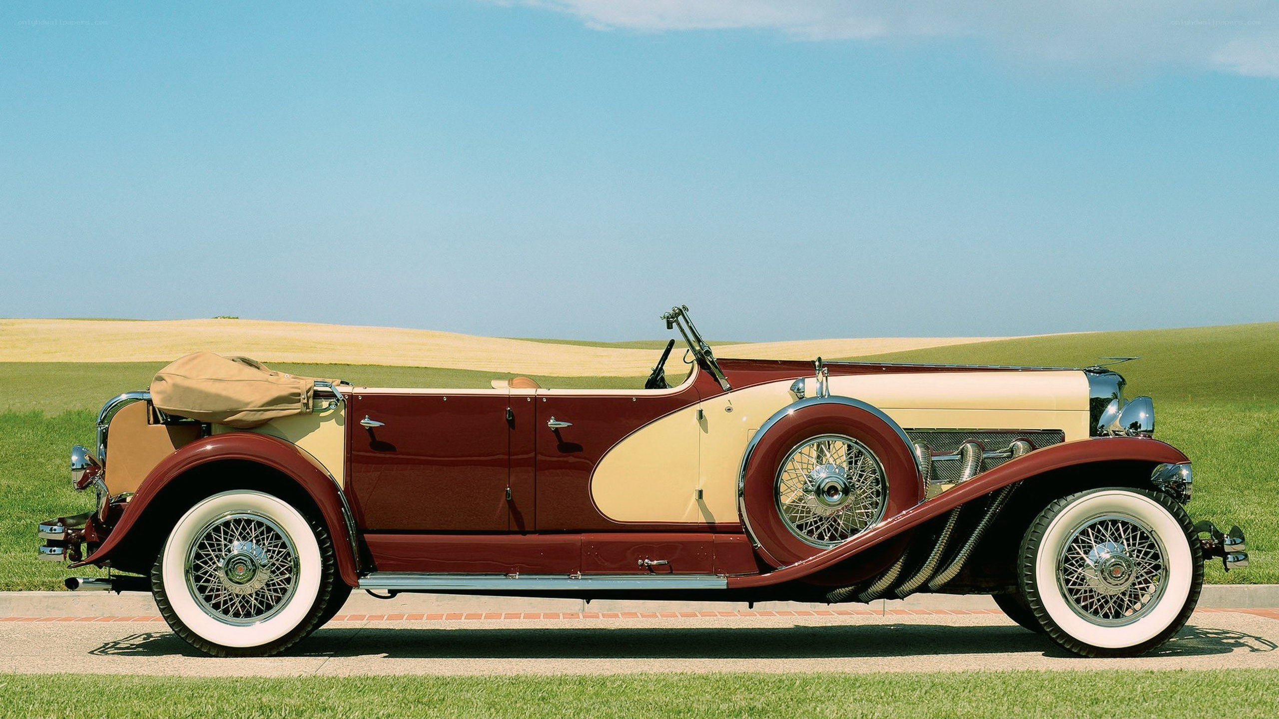 vintage maroon convertible car