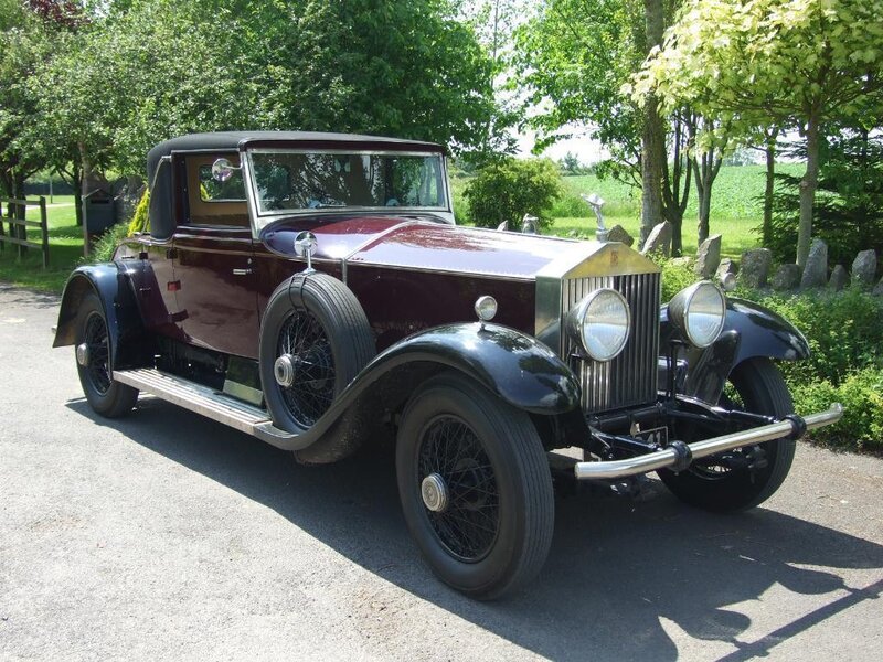 vintage maroon rolls-royce car