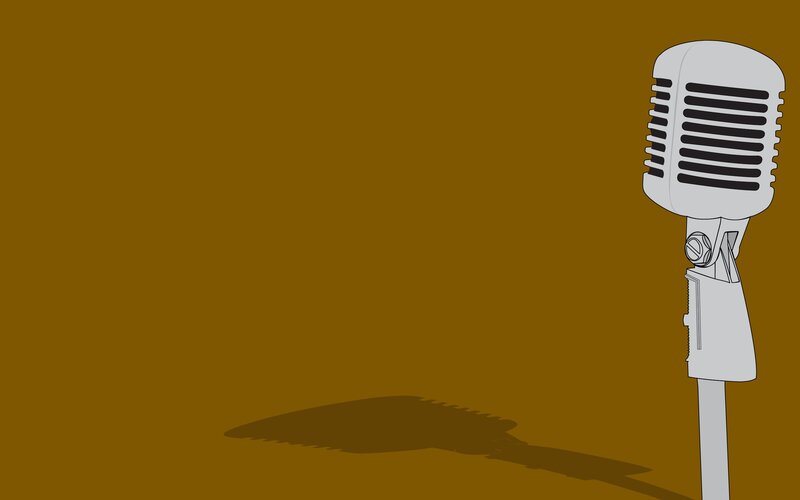 vintage microphone on brown background