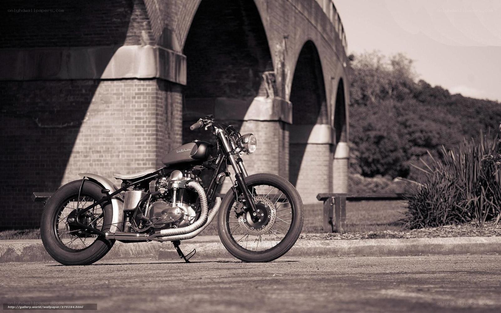 vintage motorcycle under bridge