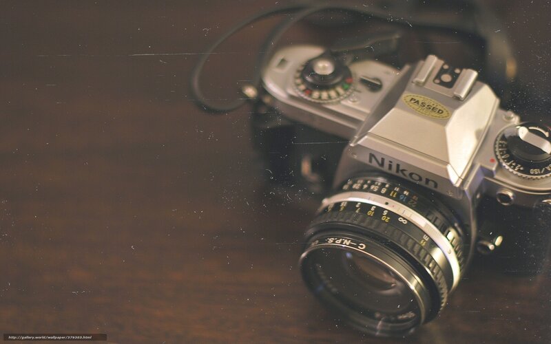 vintage nikon camera on wood