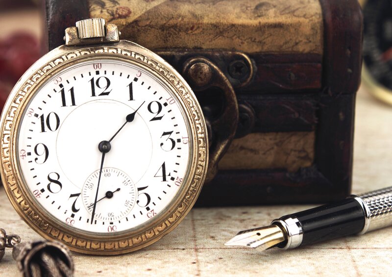 vintage pocket watch and pen