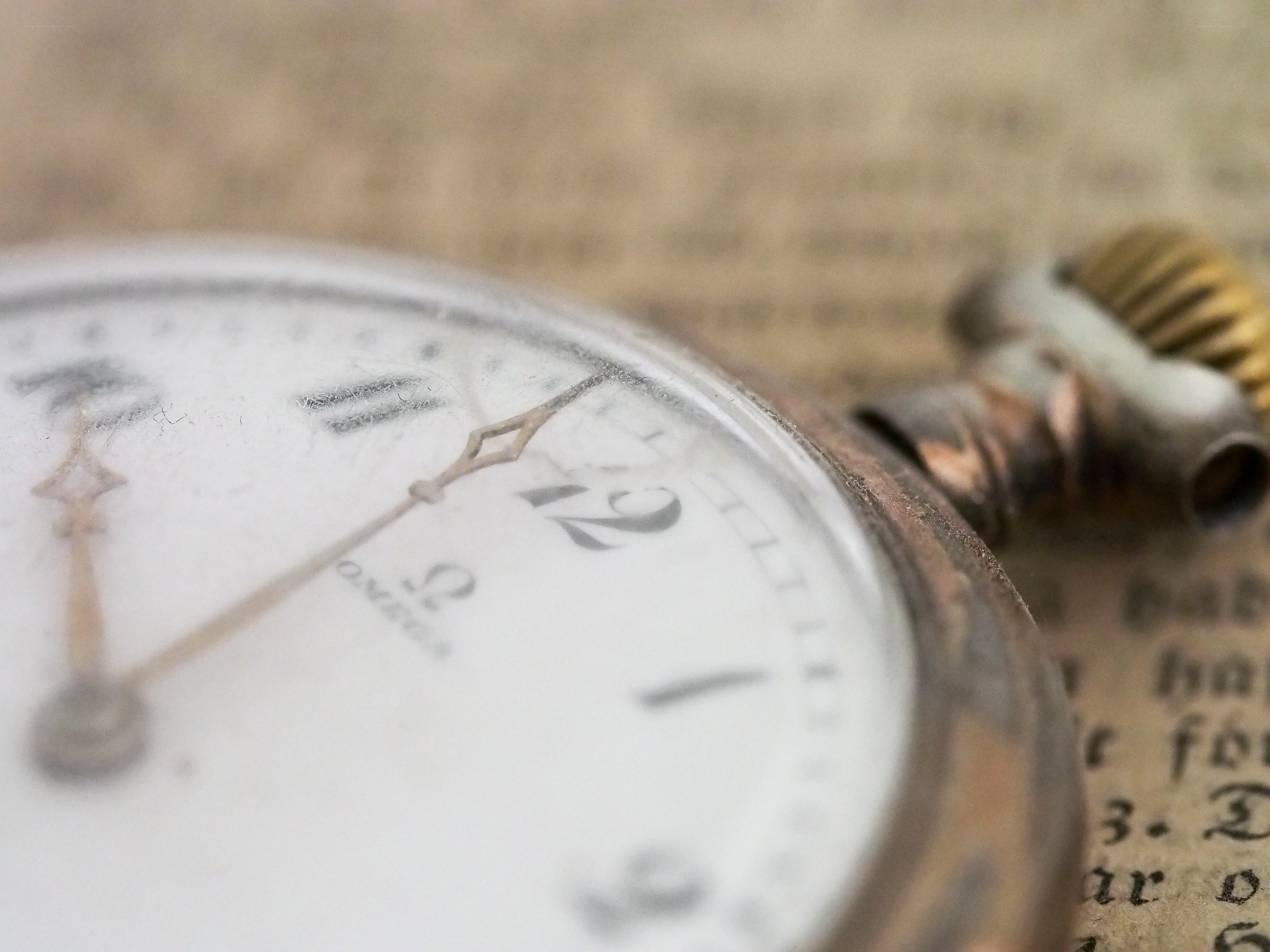vintage pocket watch on book