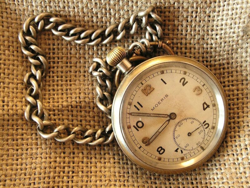 vintage pocket watch on burlap