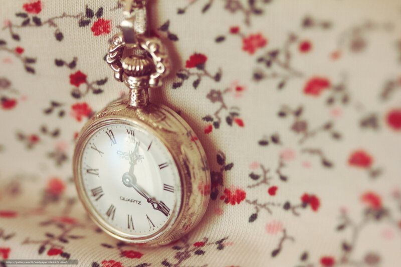 vintage pocket watch on floral fabric