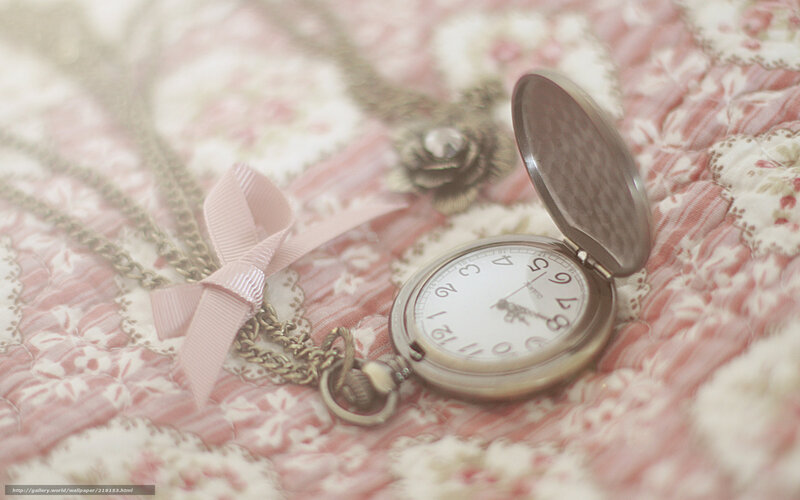 vintage pocket watch on floral fabric