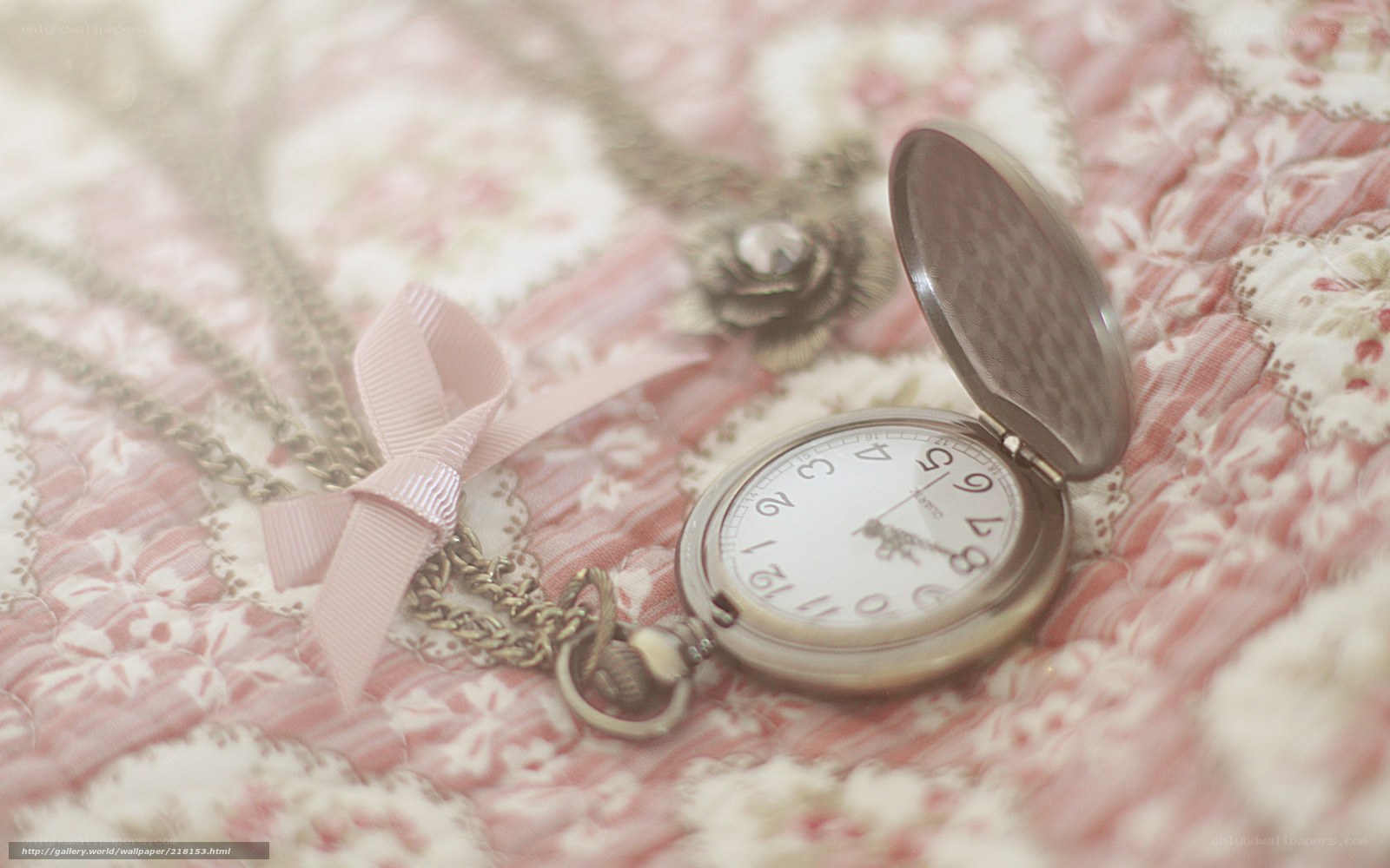 vintage pocket watch on floral fabric