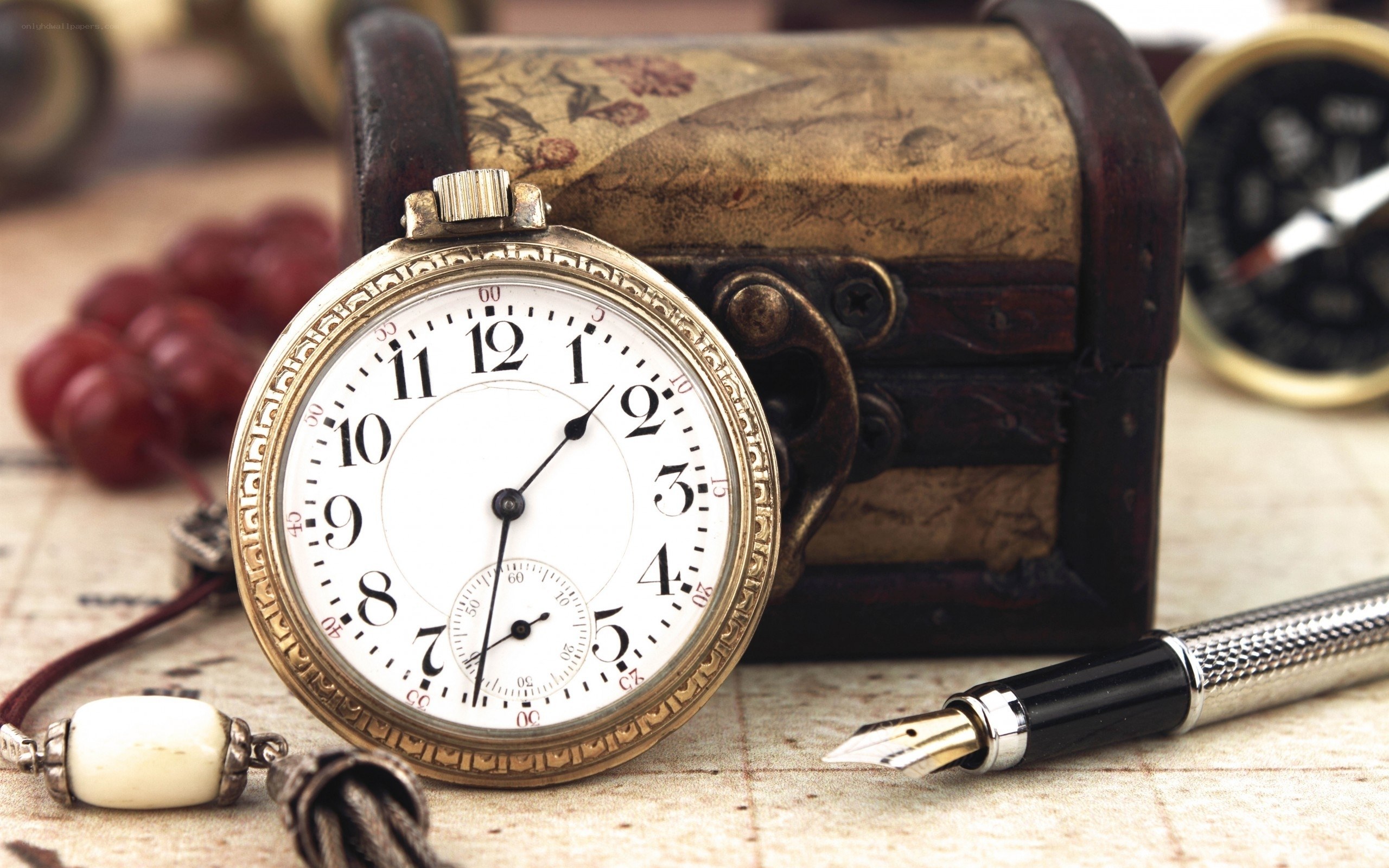vintage pocket watch on map