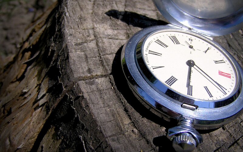 vintage pocket watch on wood