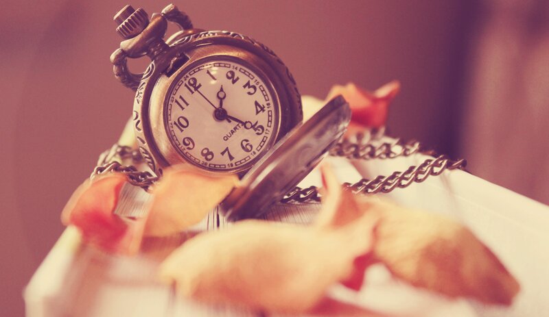 vintage pocket watch with rose petals