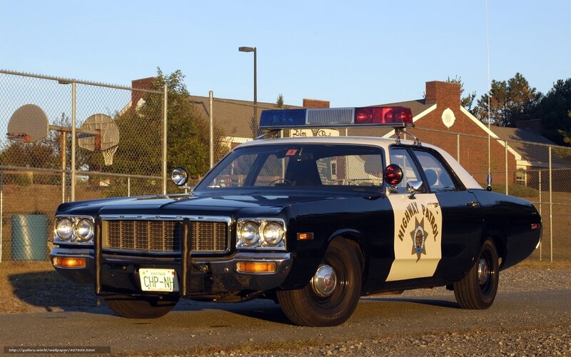 vintage police car parked outside