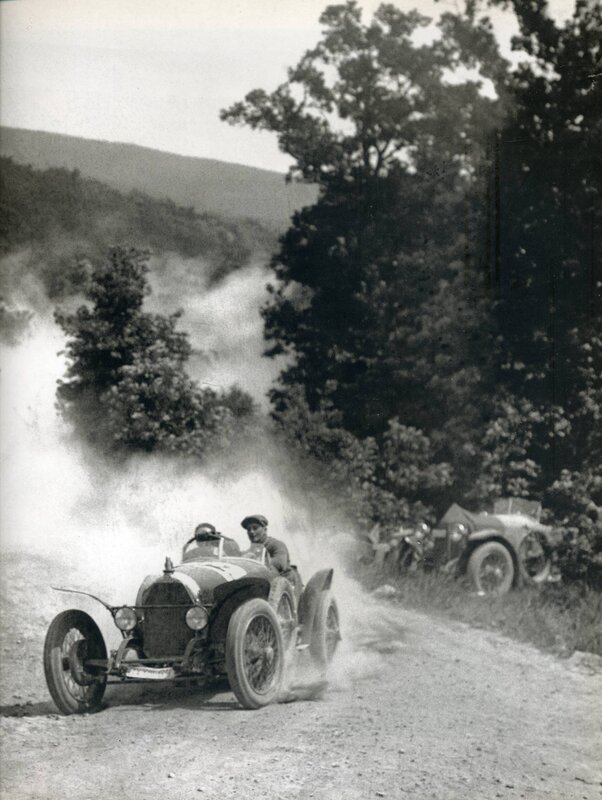 Vintage race car on dirt road