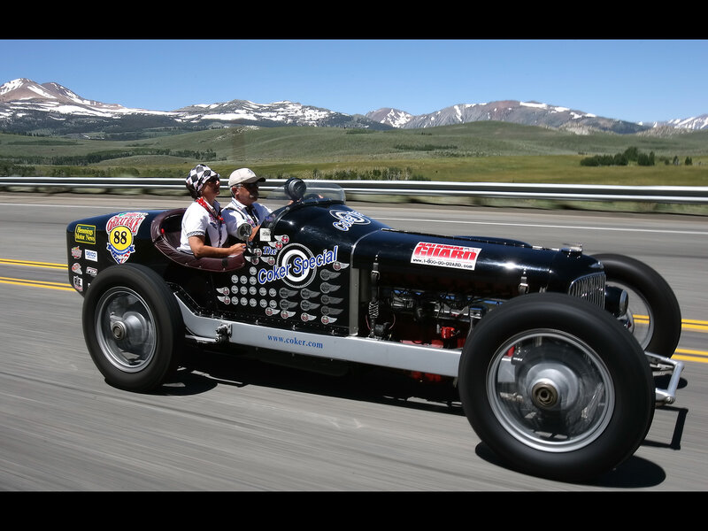 Vintage race car on mountain road
